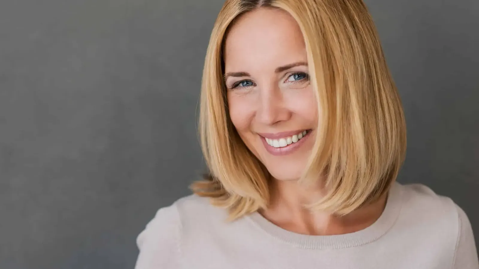Patient smiling after dental treatment at Viera Dental Design Studio